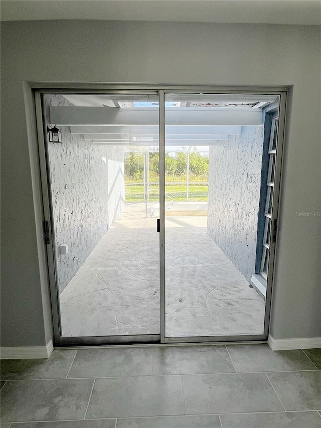 doorway with tile flooring