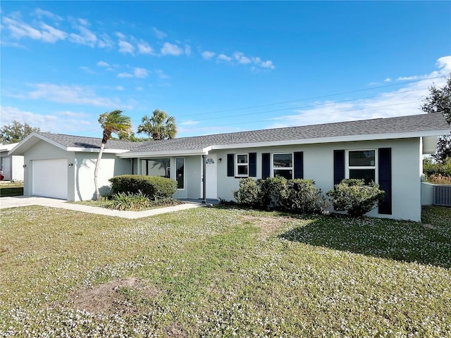 ranch-style home with a front yard and a garage