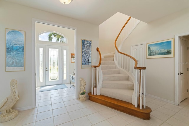 foyer entrance featuring light tile patterned floors