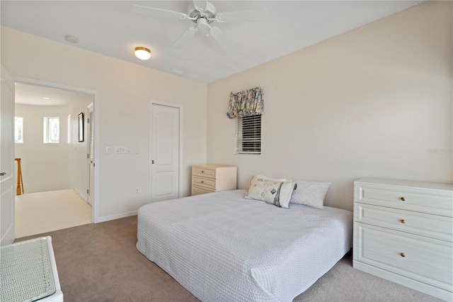 carpeted bedroom featuring ceiling fan