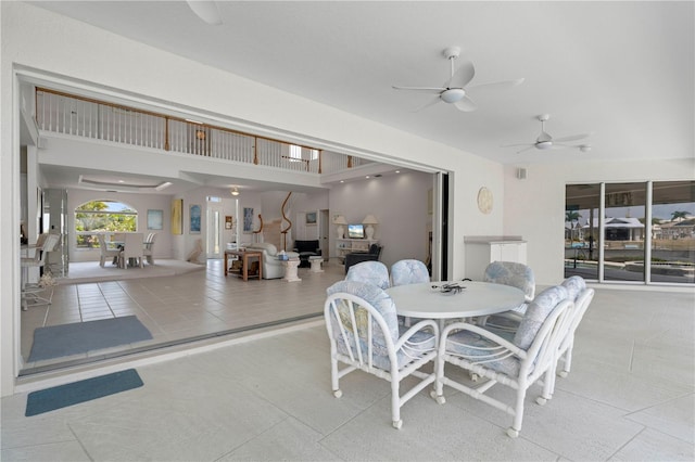 tiled dining room with ceiling fan