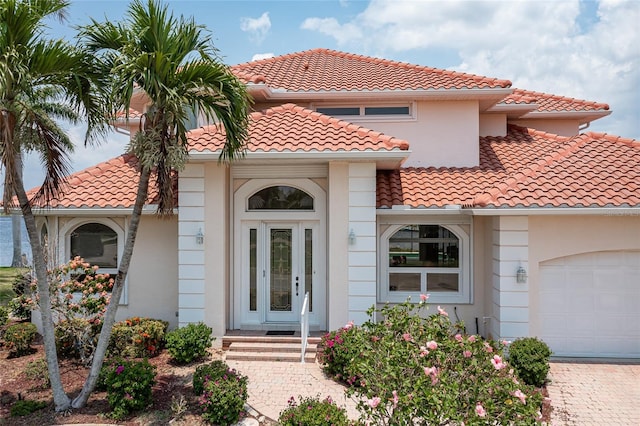 mediterranean / spanish house featuring a garage