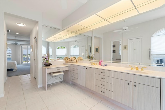 bathroom with tile patterned flooring, ceiling fan, and vanity