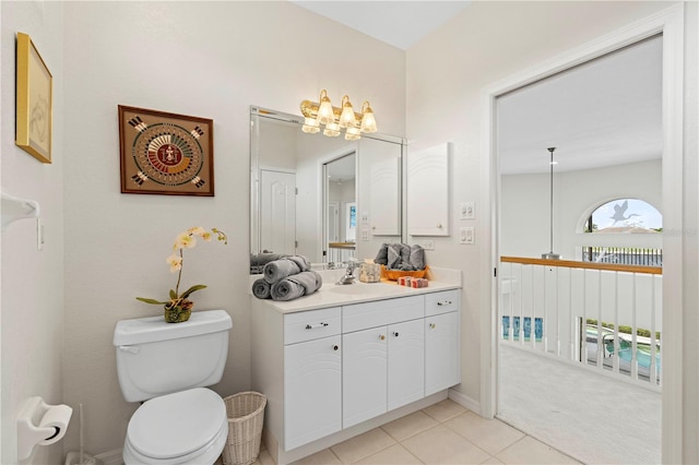 bathroom featuring vanity, toilet, and tile patterned flooring