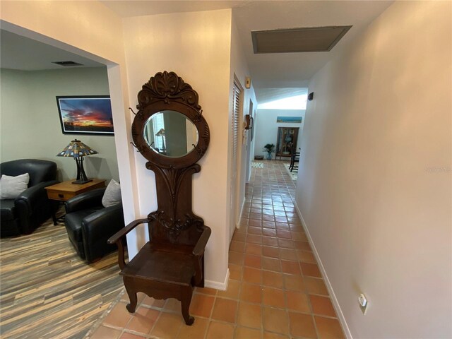 hall with tile flooring