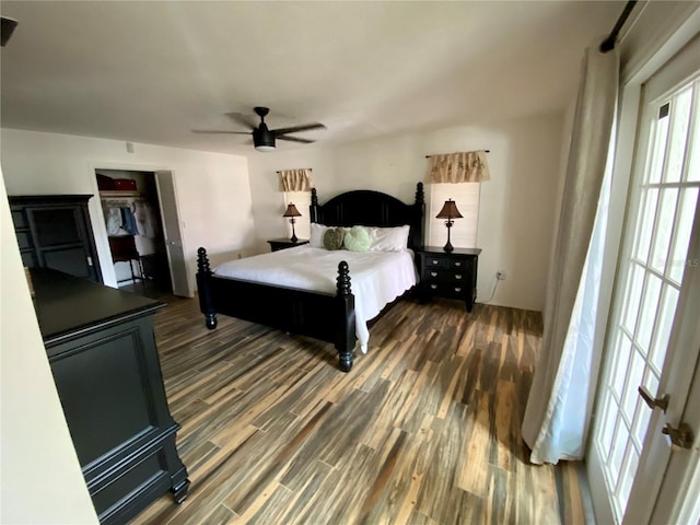 bedroom featuring a closet, ceiling fan, and dark hardwood / wood-style flooring