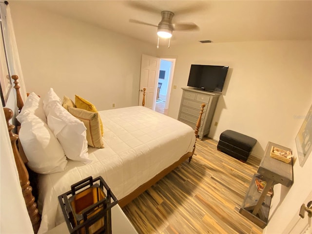 bedroom featuring hardwood / wood-style flooring and ceiling fan