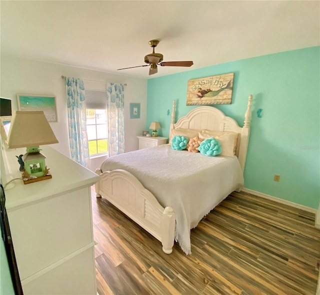 bedroom featuring ceiling fan and dark wood-type flooring