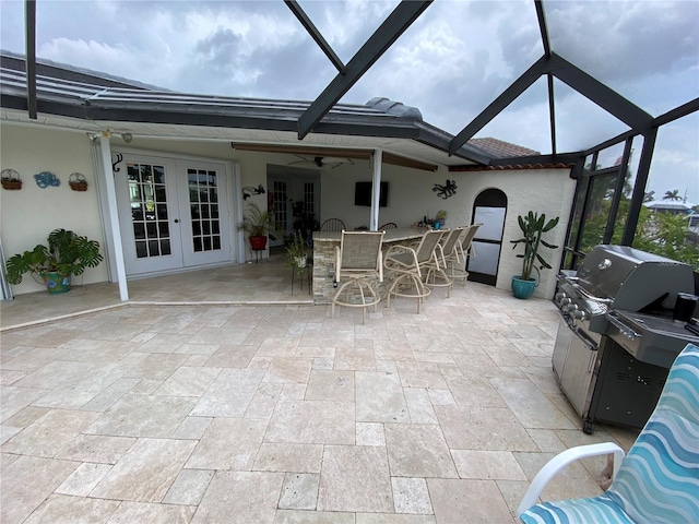 unfurnished sunroom with french doors and ceiling fan