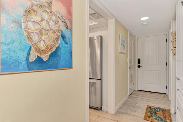 hallway featuring light hardwood / wood-style flooring