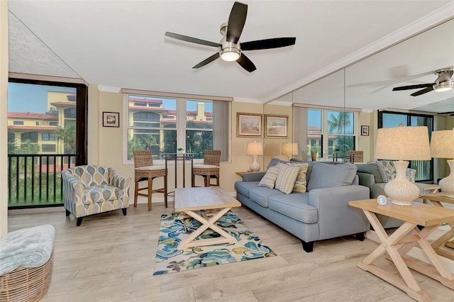 living room with ceiling fan, french doors, and light wood-type flooring