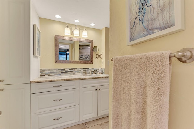 bathroom with vanity, backsplash, and tile patterned floors