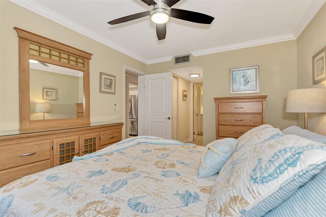 bedroom with ceiling fan and ornamental molding