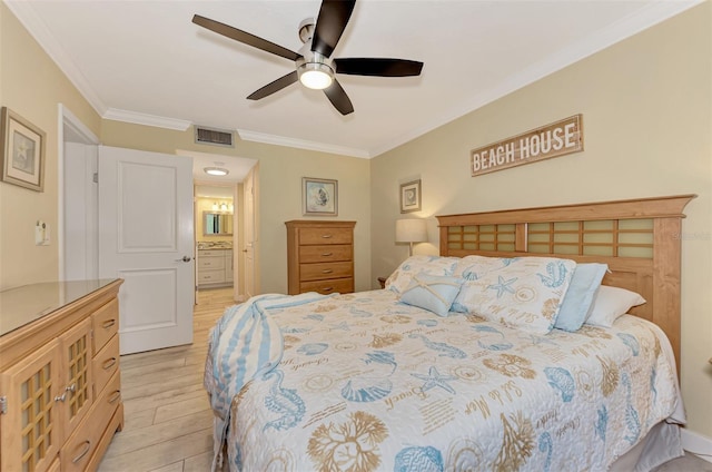 bedroom featuring ceiling fan, ensuite bathroom, crown molding, and light wood-type flooring