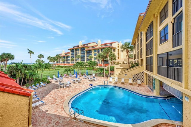 view of pool featuring a patio area