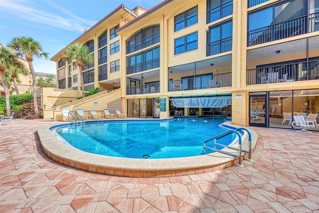 view of pool featuring a patio