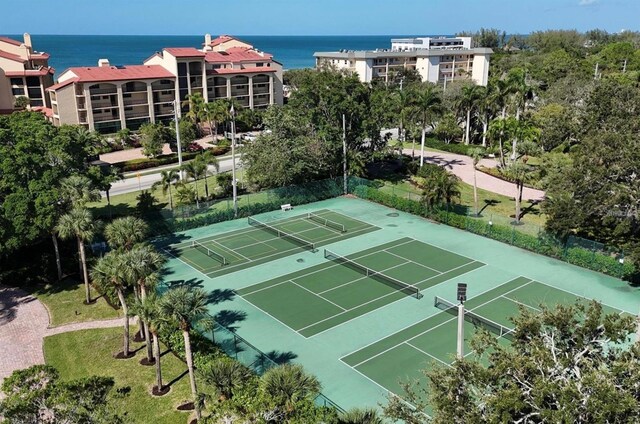 view of sport court featuring a water view