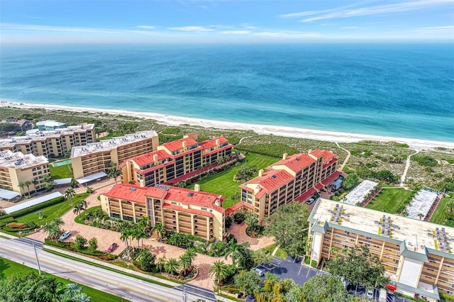 drone / aerial view featuring a view of the beach and a water view