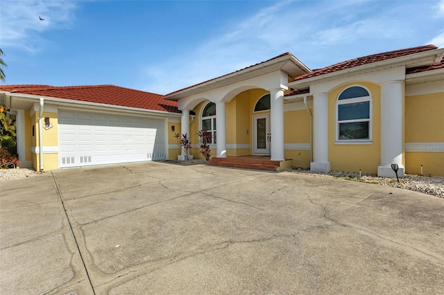 mediterranean / spanish house featuring a garage