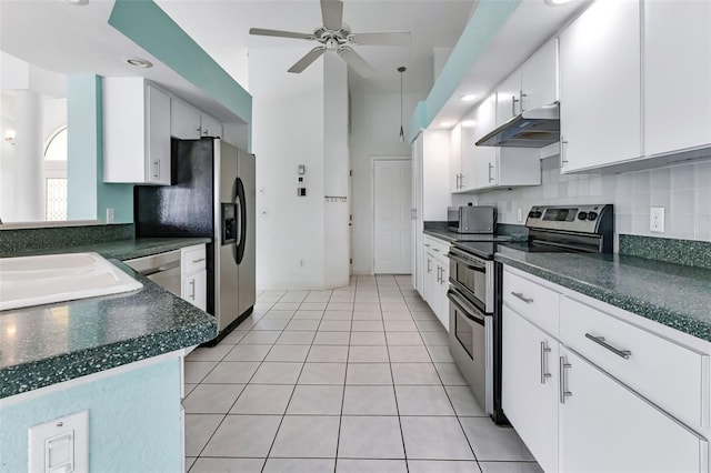 kitchen featuring white cabinetry, ceiling fan, light tile floors, and stainless steel appliances