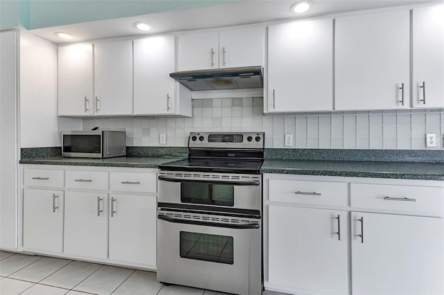 kitchen featuring stainless steel appliances, white cabinets, tasteful backsplash, and light tile floors