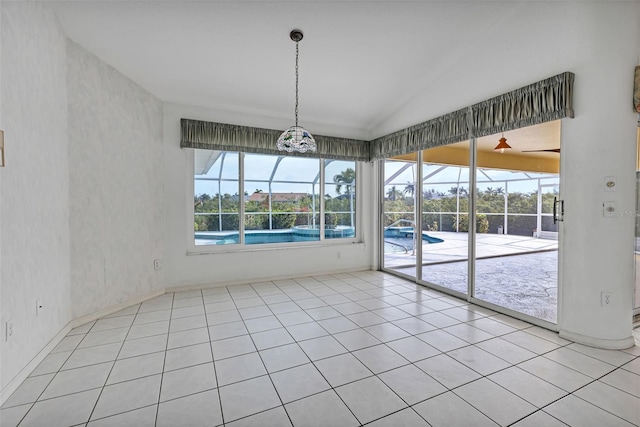 unfurnished dining area featuring a wealth of natural light, light tile floors, and lofted ceiling