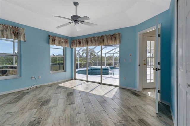 empty room featuring ceiling fan and light wood-type flooring