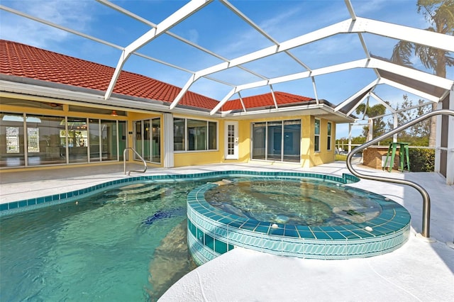 view of pool with a patio and glass enclosure