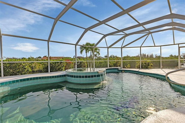 view of swimming pool with glass enclosure and an in ground hot tub