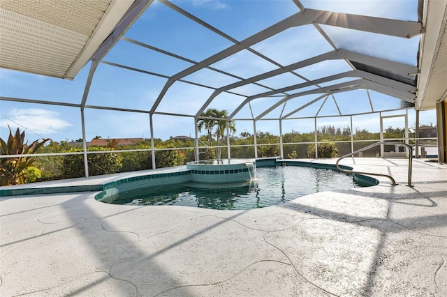 view of pool featuring a lanai, an in ground hot tub, and a patio