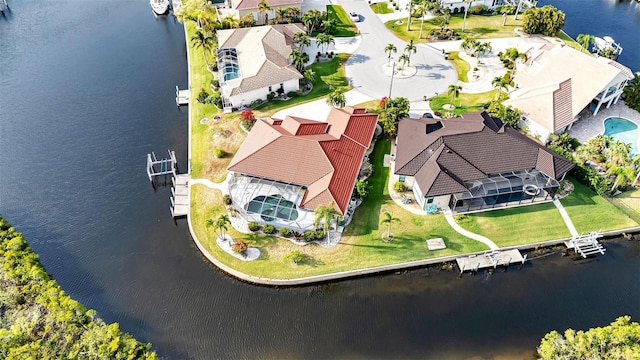 bird's eye view with a water view