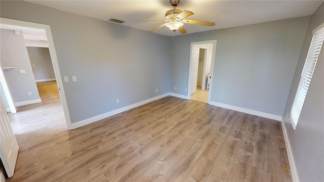 unfurnished bedroom featuring light hardwood / wood-style flooring and ceiling fan