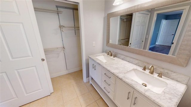 bathroom featuring tile patterned flooring and vanity