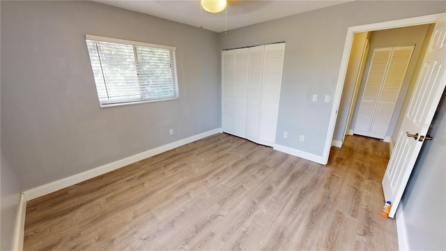 unfurnished bedroom featuring a closet and light hardwood / wood-style floors