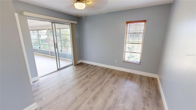 empty room featuring light hardwood / wood-style flooring and ceiling fan