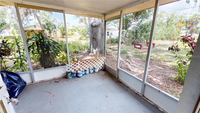 unfurnished sunroom featuring a wealth of natural light