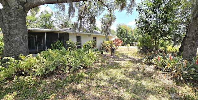 view of yard with a sunroom