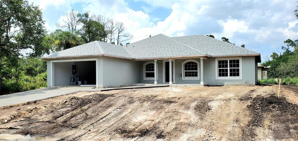 ranch-style home featuring a garage