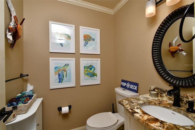 bathroom with ornamental molding, toilet, and large vanity