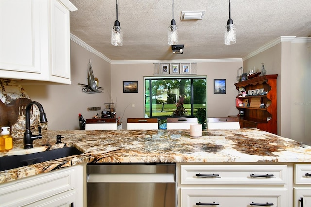 kitchen featuring decorative light fixtures, crown molding, white cabinets, and a textured ceiling