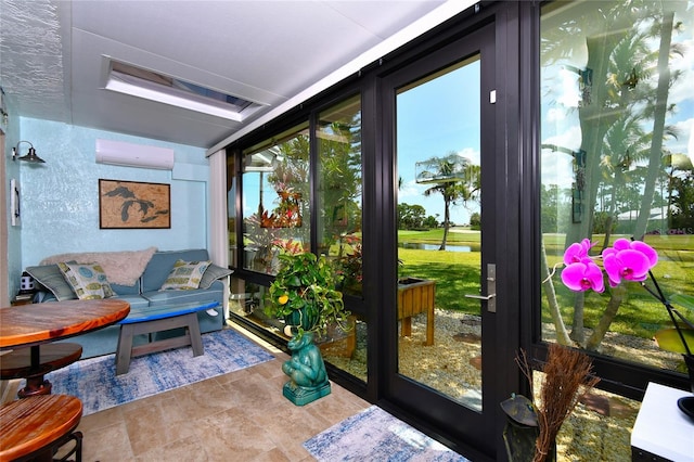 sunroom featuring a wall unit AC