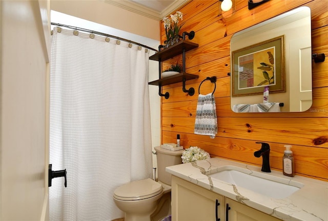 bathroom with ornamental molding, toilet, and vanity