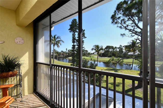 balcony featuring a water view