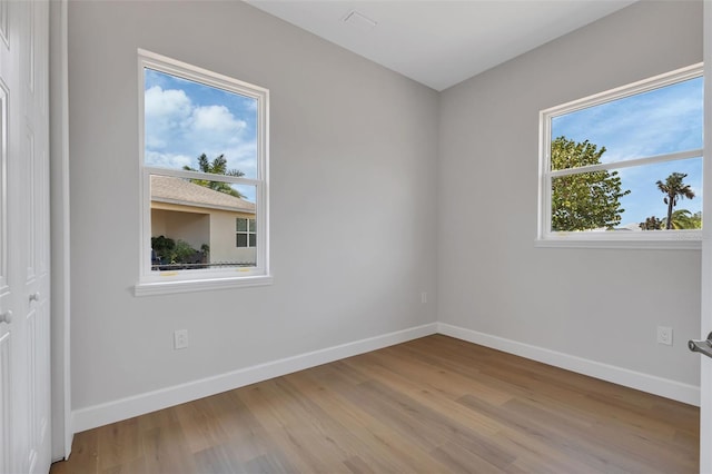 unfurnished room featuring light wood-type flooring