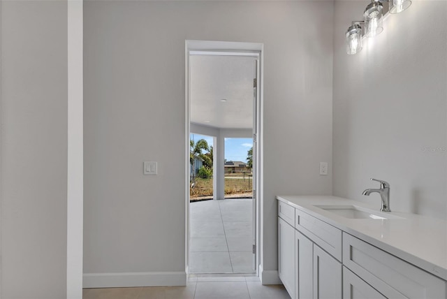 bathroom with vanity and tile patterned flooring