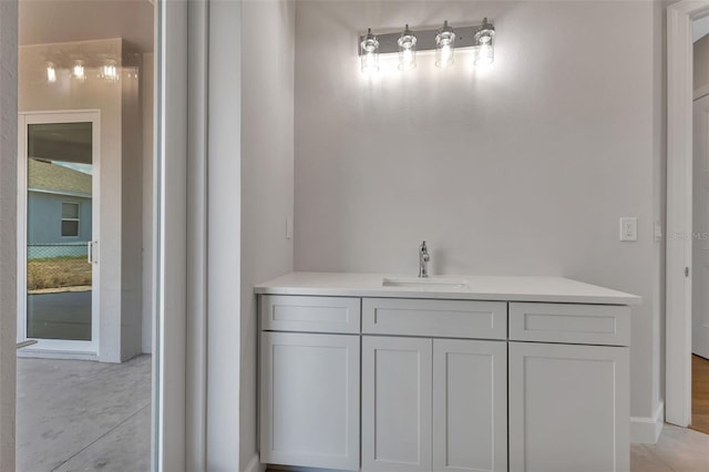 bathroom with tile patterned flooring and vanity