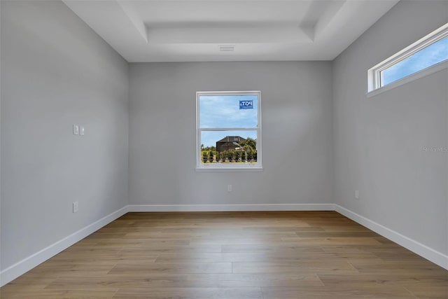 spare room featuring light hardwood / wood-style floors