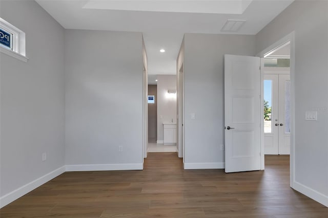 unfurnished room featuring dark hardwood / wood-style floors