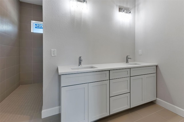 bathroom with vanity and tile patterned flooring