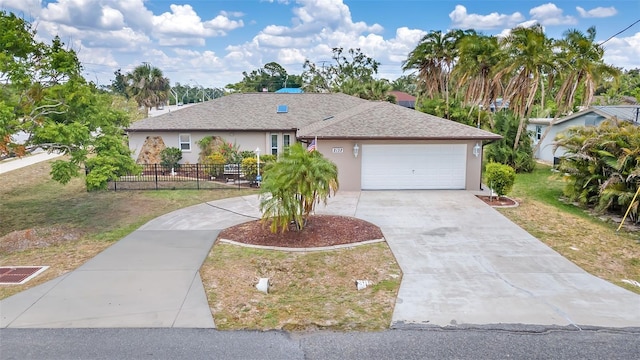 ranch-style home with a front yard and a garage